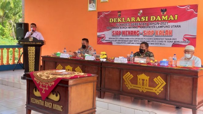 
 caption : Camat Bunga Mayang Ediyansyah, ST.MM saat memberikan sambutan pada acara Deklarasi Damai Pilkades serentak 2021  